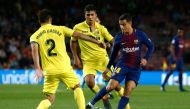 Barcelona's Brazilian midfielder Philippe Coutinho (R) challenges Villarreal's Spanish defender Mario and Villarreal's Spanish midfielder Rodrigo Hernandez (C) during the Spanish league football match between Barcelona and Villarreal at the Camp Nou Stadi