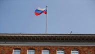 File photot of the Russian flag waves in the wind on the rooftop of the Consulate General of Russia in San Francisco, California, US, September 2, 2017. REUTERS/Stephen Lam 