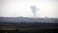 Smoke rises following an explosion in the northern Gaza Strip, as seen from the Israeli side of the border between Israel and Gaza, May 14, 2018. REUTERS/Amir Cohen