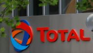 The logo of French oil giant Total is seen at La Defense business and financial district in Courbevoie, near Paris, France. May 16, 2018. REUTERS/Charles Platiau