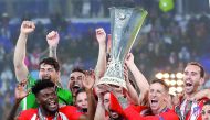 Atletico Madrid's Gabi and Fernando Torres lift the trophy as they celebrate winning the Europa League Reuters/Peter Cziborra   