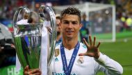Real Madrid's Cristiano Ronaldo gestures as he celebrates winning the Champions League with the trophy REUTERS/Hannah McKay