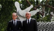 Turkish Foreign Minister Mevlut Cavusoglu and his German counterpart Heiko Maas commemorate the 25th anniversary of an arson attack killing two Turkish women and three girls by right-wing extremists in Solingen, Germany, May 29, 2018. REUTERS/Wolfgang Rat