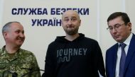 Russian journalist Arkady Babchenko (C), who was reported murdered in the Ukrainian capital on May 29, Ukrainian Prosecutor General Yuriy Lutsenko (R) and head of the state security service (SBU) Vasily Gritsak attend a news briefing in Kiev, Ukraine May 