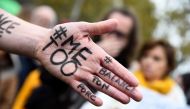 Me too on the hand of a protester during a gathering on the Place de la Republique square in Paris on October 29, 2017. (AFP / Bertrand Guay) 
