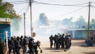 Malian anti-riot police officers arrive to control a demonstration against the lack of transparency of the presidential election's campaign, on June 2, 2018 in Bamako. AFP / Michele CATTANI