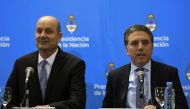 Argentina's Central Bank Governor Federico Sturzenegger (L) and Argentina's Finance Minister Nicolas Dujovne arrive for a press conference in Buenos Aires, Argentina, on June 7, 2018. AFP / Eitan Abramovich