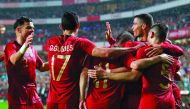 Portuguese forward Goncalo Guedes (2L) celebrates with teammates defender Pepe (L) and forward Cristiano Ronaldo (R) after scoring a goal during the friendly football match between Portugal and Algeria, on June 7, 2018 at the Luz stadium in Lisbon. AFP / 