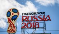 2018 FIFA World Cup logo on top of a building in Moscow. / AFP / Mladen ANTONOV 