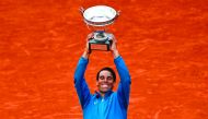 TOPSHOT - Spain's Rafael Nadal holds La Coupe des Mousquetaires - The Musketeers' Trophy after defeating Austria's Dominic Thiem in their men's singles final match on day fifteen of The Roland Garros 2018 French Open tennis tournament in Paris on June 10,