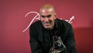 Former French football player and European Leukodystrophy Association (ELA) patron Zinedine Zidane poses with the 