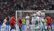 Portugal's forward Cristiano Ronaldo (2L) shoots to score his third goal during the Russia 2018 World Cup Group B football match between Portugal and Spain at the Fisht Stadium in Sochi on June 15, 2018. (AFP / Nelson Almeida)