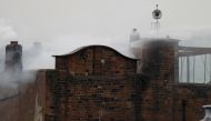 Firefighters attend to a blaze at the Mackintosh Building at the Glasgow School of Art, which is the second time in four years, Glasgow, Scotland, Britain June 16, 2018. REUTERS/Russell Cheyne