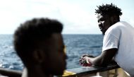 This handout picture obtained on June 15, 2018 from French non-governmental organisation Medecins Sans Frontieres - Doctors Without Borders (MSF) shows migrants onboard the MV Aquarius at sea on June 14, 2018. AFP PHOTO / MEDECINS SANS FRONTIERES 