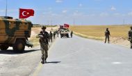 Armoured vehicles and soldiers of Turkish Armed Forces start to patrol between northern Syrian city of Manbij and Turkey's Operation Euphrates Shield area on June 18, 2018.   Anadolu Agency
