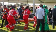 Medics attend to people injured in an explosion during a rally by Zimbabwean President Emmerson Mnangagwa in Bulawayo, Zimbabwe June 23, 2018. Tafadzwa Ufumeli/via REUTERS 