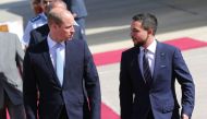 Jordanian Crown Prince Hussein bin Abdullah (R) greets Britain's Prince William, Duke of Cambridge, at Amman's Marka military airport on June 24, 2018. AFP / Khalil Mazraawi 