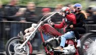 A biker rides his Harley-Davidson during a parade at the 