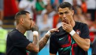 Portugal's forward Cristiano Ronaldo (R) and Portugal's forward Ricardo Quaresma speak ahead of the Russia 2018 World Cup Group B football match between Iran and Portugal at the Mordovia Arena in Saransk on June 25, 2018. / AFP / Jack GUEZ