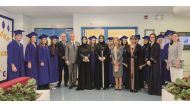 Students with officials during the graduation ceremony.