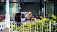 A van is seen burned out after crashing into the glass facade of the head office of Dutch newspaper De Telegraaf in what police said was a deliberate action in Amsterdam, Netherlands June 26, 2018. REUTERS/Piroschka van de Wouw 