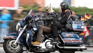 A biker rides his Harley-Davidson during a parade at the 