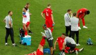 England's Harry Maguire and Jamie Vardy receive medical attention, Colombia vs England, Spartak Stadium, Moscow, Russia, July 3, 2018. Reuters/Christian Hartmann