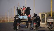 Syrian families return to their homes in towns and villages situated on the southern outskirts of Daraa on June 6, 2018. The Syrian regime reached a ceasefire deal with rebels in the country's south, the official SANA news agency said. AFP / Mohamad Abaze