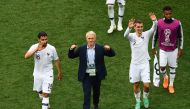(L to R) France's midfielder Nabil Fekir, France's coach Didier Deschamps, France's forward Antoine Griezmann and France's forward Thomas Lemar celebrate with the fans following their win during the Russia 2018 World Cup quarter-final football match betwe