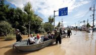 Japan Self-Defense Force soldiers rescue people from a flooded area in Mabi town in Kurashiki, Okayama Prefecture, Japan, July 8, 2018. REUTERS/Issei Kato
 