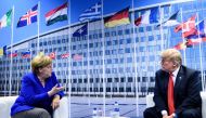 
German Chancellor Angela Merkel (L) and US President Donald Trump (R) make a statement to the press after a bilateral meeting on the sidelines of the NATO (North Atlantic Treaty Organization) summit at the NATO headquarters, in Brussels, on July 11, 201