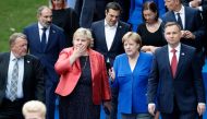 Denmark's PM Lars Lokke Rasmussen, Norway's PM Erna Solberg, German Chancellor Angela Merkel and Poland's President Andrzej Duda speak as they arrive for a working dinner at The Parc du Cinquantenaire - Jubelpark Park in Brussels on July 11, 2018, during 