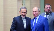 Russian President Vladimir Putin shakes hands with Ali Akbar Velayati, a top advisor to Iran's Supreme Leader Ayatollah Ali Khamenei, during their meeting at the Novo-Ogaryovo state residence outside Moscow, Russia July 12, 2018. Sputnik/Alexei Druzhinin/