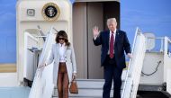 US President Donald Trump and First Lady Melania Trump disembark from Air Force One upon arrival at Helsinki-Vantaa Airport in Helsinki, on July 15, 2018 on the eve of a summit in Helsinki between the US President and his Russian counterpart. AFP / Lehtik