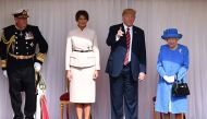 US President Donald Trump and First Lady Melania Trump stand with Britain's Queen Elizabeth on the dais in the Quadrangle at Windsor Castle, Windsor, Britain July 13, 2018. Ben Stansall/Pool via REUTERS
 