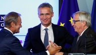 European Council President Donald Tusk greets European Commission President Jean-Claude Juncker next to NATO Secretary General Jens Stoltenberg after signing a new joint declaration on EU-NATO cooperation in Brussels, Belgium July 10, 2018. Reuters/Franco