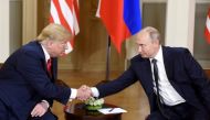 U.S. President Donald Trump shakes hands with Russia's President Vladimir Putin during a meeting in Helsinki, Finland July 16, 2018. Lehtikuva/Heikki Saukkomaa via REUTERS