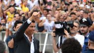 Portuguese attacker Cristiano Ronaldo gestures as he arrives on July 16, at the Juventus medical center at the Alliance stadium in Turin. Cristiano Ronaldo arrived in Turin ahead of his official unveiling as Juventus' superstar summer signing on July 17. 