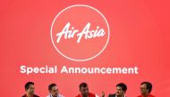 AirAsia boss Tony Fernandes (C) is accompanied by AirAsia X Indonesia CEO Sulistyo Nugroho Hanung (L), AirAsia X Thailand CEO Nadda Buranasiri (2nd-L), AirAsia X Malaysia CEO Benyamin Ismail (2nd-R) and AirAsia Group CEO of Indonesia Dendy Kurniawan (R) a