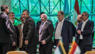 Egyptian Intelligence services head Khaled Fawzi  laugh with Hamas leaders Izzat al-Rishq and  Yahya Sinwar in the presence of Azzam al-Ahmad and Rawhi Fattouh of Fatah (AFP / Khaled Desouki)  