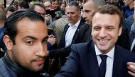 Emmanuel Macron (R) flanked by Alexandre Benalla (L), head of security, attends a campaign visit in Rodez, France, May 5, 2017. REUTERS/Regis Duvignau/File picture