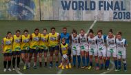 Brazilian football star Neymar (C) poses with his son Davi Lucca and female players before a game during a five-a-side football tournament for his charity Neymar Junior Project Institute, in Praia Grande, Sao Paulo, Brazil, on July 21, 2018. / AFP / Migue