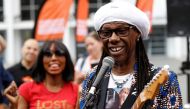 Musician Nile Rodgers poses for photographs as he launches International Busking Day at Wembley Park, in London, Britain, July 21, 2018. Reuters/Peter Nicholls

