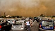 Cars are blocked at the closed National Road during a wildfire in Kineta, near Athens, on July 23, 2018. (AFP / VALERIE GACHE)