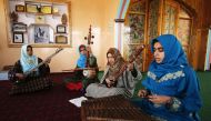 In this photograph taken on February 25, 2017 Kashmiri girls play instruments and sing Sufi music under the tutelage of music teacher Muhammad Yaqoob Sheikh on the outskirts of Srinagar (AFP) 
