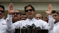 Cricket star-turned-politician Imran Khan, chairman of Pakistan Tehreek-e-Insaf (PTI), speaks to members of media after casting his vote at a polling station during the general election in Islamabad, Pakistan, July 25, 2018. Reuters/Athit Perawongmetha