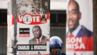 Police stand guard during a raid on the headquarters of the opposition Movement for Democratic Change (MDC) a day after post-election clashes between security forces and opposition protesters in Harare, Zimbabwe, August 2, 2018. Reuters/Mike Hutchings