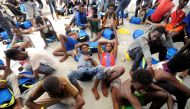 Migrants rest after being rescued by SOS Mediterranee organisation and Doctors Without Borders during a search and rescue (SAR) operation with the MV Aquarius rescue ship in the Mediterranean Sea, off the Libyan Coast, August 10, 2018. Reuters/Guglielmo M