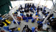 Migrants are seen on board the MV Aquarius, in the Mediterranean Sea, between Malta and Linosa, August 14, 2018. (REUTERS/Guglielmo Mangiapane)
