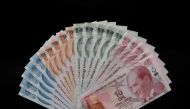 Turkish lira banknotes are seen in this picture illustration in Istanbul, Turkey August 14, 2018. Reuters/Murad Sezer